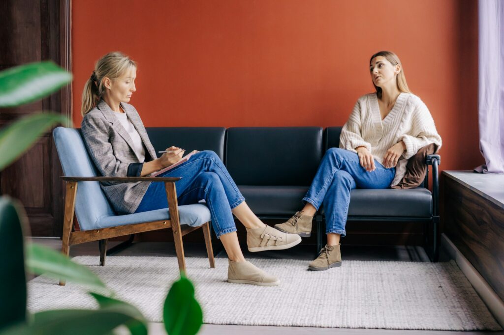 A female psychotherapist attentively listens