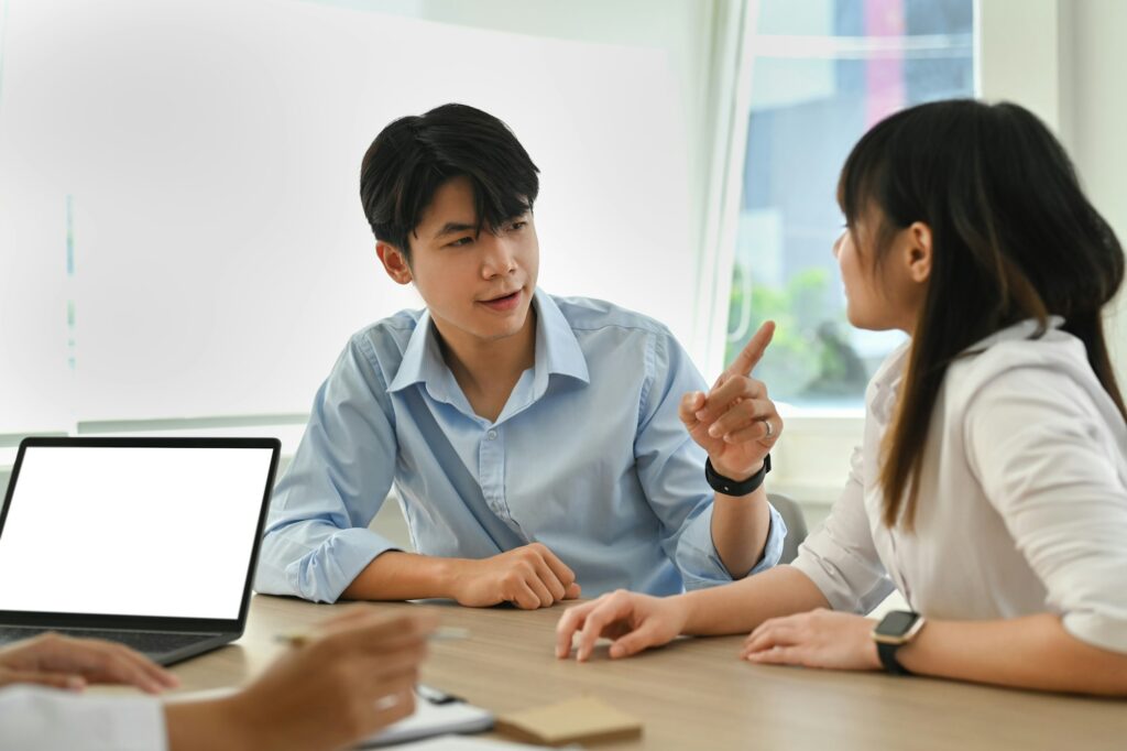 Asian couple arguing during family therapy counselling