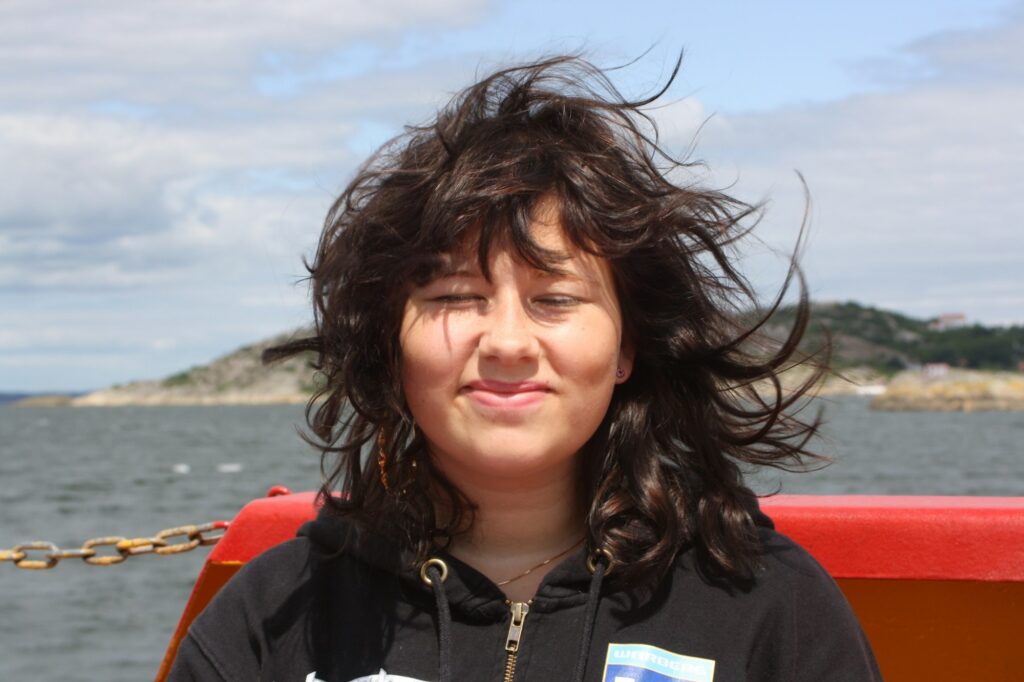 Happy teenager girl on a ferry