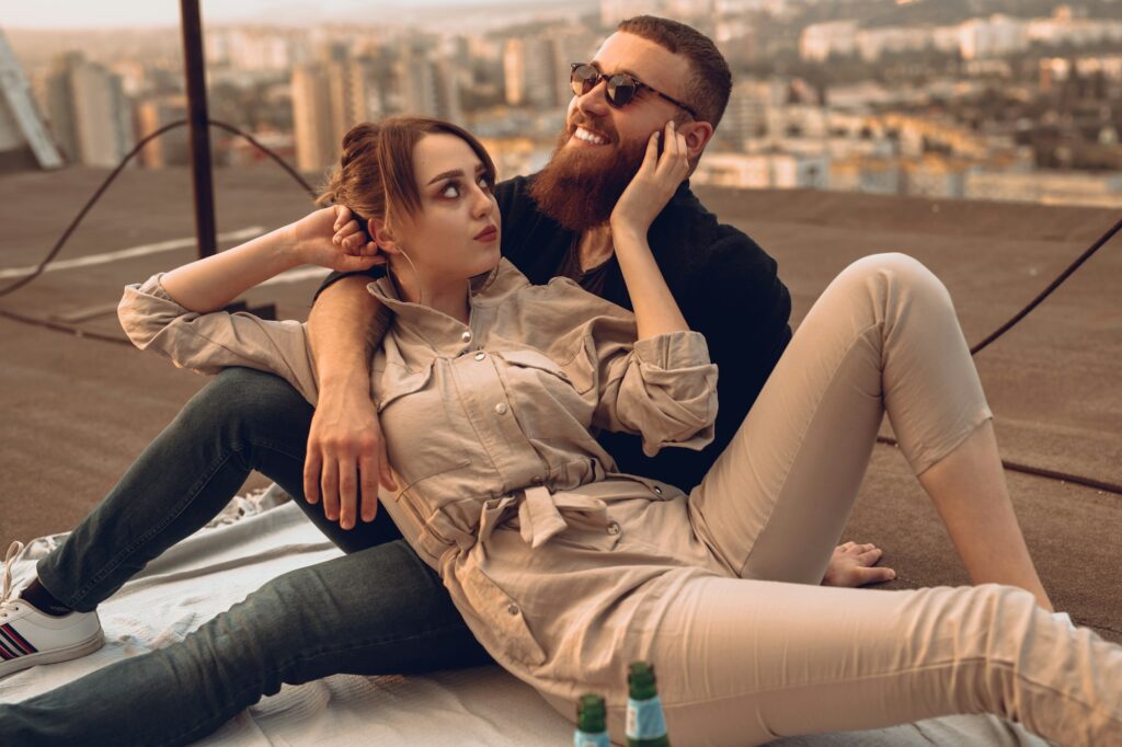 Modern couple in love dating on rooftop