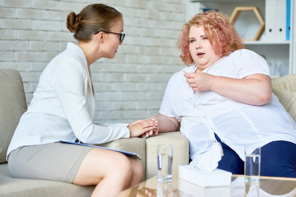 Obese Young Woman Discussing Depression with Psychiatrist